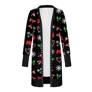 Close-up of black Christmas cardigan featuring festive prints and silver rivet detailing
