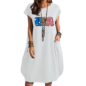 Detail of white cotton linen dress showing the USA leopard print and side pockets
