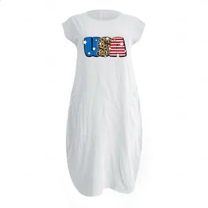 Detail of USA print and side pockets on a white cotton linen summer maxi dress