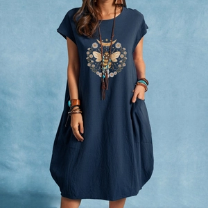 Women's navy cotton linen dress featuring bee daisy print and practical side pockets