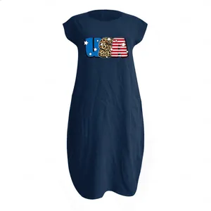 Close-up of USA flag print and texture on dark blue cotton linen dress with pockets