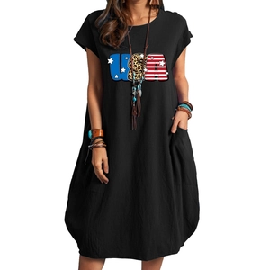 Detail of loose black cotton linen dress featuring USA flag leopard print and side pockets