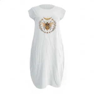 Detail of vintage bee and daisy floral print on white cotton linen pocket dress