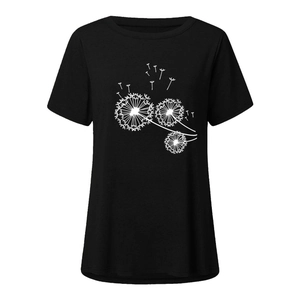 Detailed view of white dandelion print on black cotton fabric of women t-shirt