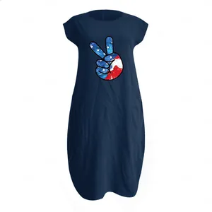 Detail of navy cotton linen dress with USA flag peace sign print and side pockets