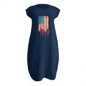 Detail of navy blue cotton linen maxi dress with vintage American flag rifle print