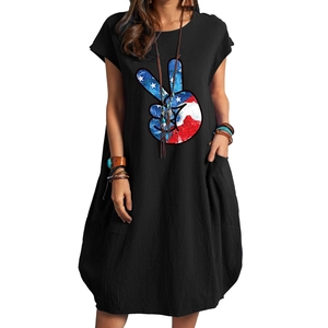 Detail of the American flag peace sign print on a black loose cotton linen midi dress