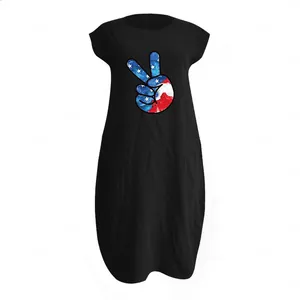 Detail of loose black cotton linen dress with American flag peace sign print