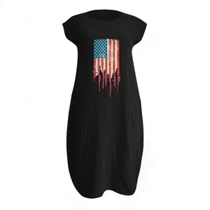 Detail of loose black cotton linen maxi dress with American flag print and gun graphics