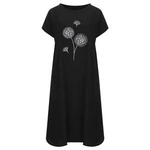 Detailansicht eines Leinenkleides mit Pusteblumen-Druck und praktischen Seitentaschen