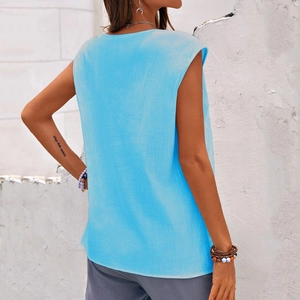 Detail of light blue sleeveless cotton linen vest with a relaxed fit and round neck