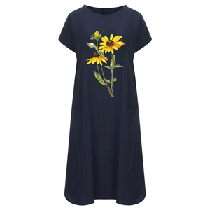 Detail of sunflower print pattern and functional side pockets on navy cotton linen dress
