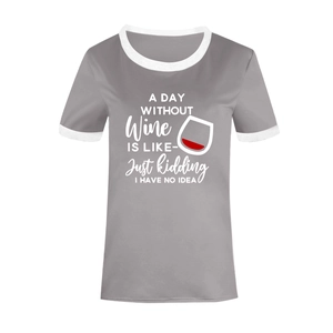 Close-up of contrast white trim on crew neck and gray cotton fabric of the graphic tee