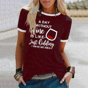 Detail of burgundy T-shirt featuring contrast white trim and humorous wine glass print