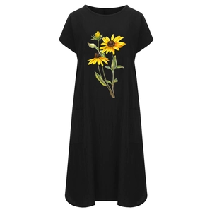 Detail view of sunflower print on black cotton linen dress with practical side pockets