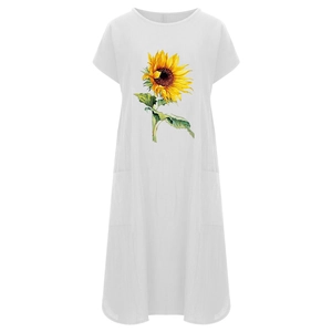 Detalle del vibrante estampado de girasoles y el bolsillo lateral en el vestido de lino