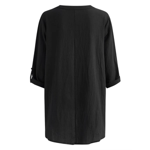 Back view of a black cotton linen blouse showing detailed fabric texture and vertical seam