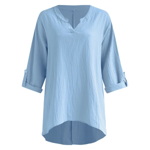Detail of light blue cotton linen shirt showing V-neck and high-low curved hem