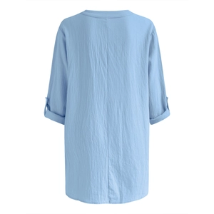 Back view of light blue linen-textured shirt featuring buttoned rolled-up sleeves