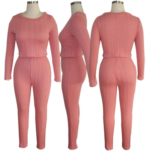 Three-angle view of pink cable knit set featuring cropped sweater and high waist pants
