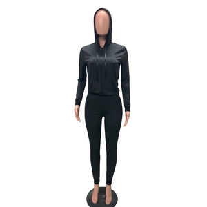 Detail view of charcoal grey two-piece tracksuit featuring a hooded zip-up jacket and leggings