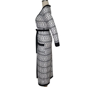 Detail view of long-sleeve cardigan featuring black and white geometric diamond pattern with belt