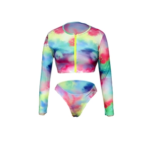 Detail of colorful tie-dye long sleeve two-piece swimsuit with vibrant yellow front zipper