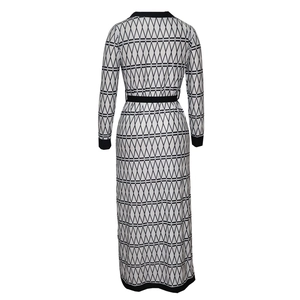 Rear view of long sleeve maxi dress featuring black and white geometric diamond pattern
