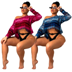 Women's long sleeve mesh crop top with vibrant snakeskin animal print in pink and blue