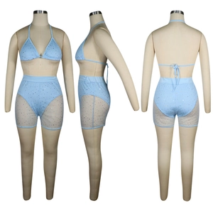 Detail view of light blue bikini top and mesh shorts with sparkling rhinestones