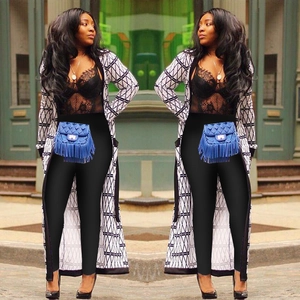 Women's long cardigan with black and white geometric pattern and tassel belt bag