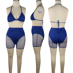 Detailed views of a blue two-piece swimsuit with rhinestones and sheer mesh panels