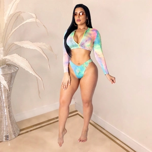 Detail of two-piece long sleeve swimsuit with colorful tie-dye print and front zipper