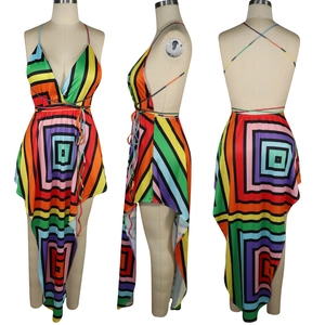 Detail of multi-color geometric print halter dress with irregular high-low hemline and open back