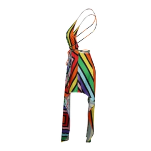 Detail of V-neck halter dress with colorful geometric stripes and tassel irregular hem
