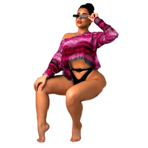 Detail of pink snakeskin print one-shoulder crop top and black buckled bikini bottom