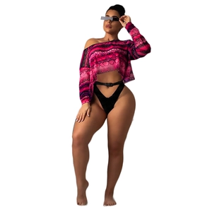 Detail of pink snake print off-shoulder mesh top with high-cut bikini bottom and belt