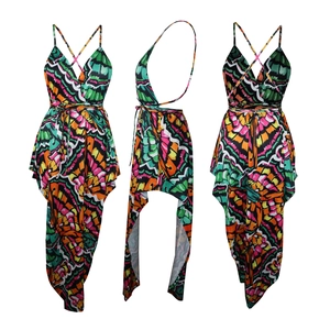 Detail of multi-color printed dress featuring a deep V-neck and high-low hemline design