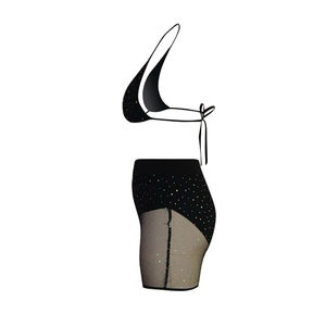 Detail of black two-piece mesh set with sparkling sequins and halter neck bikini top
