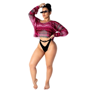 Detail of pink snake print mesh crop top with long sleeves and sheer fabric texture
