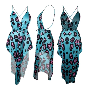Detail of high-low leopard print dress featuring a deep V-neck and crossover back straps
