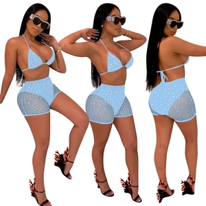 Women's two-piece blue polka dot bikini set with high waist mesh shorts front and back views