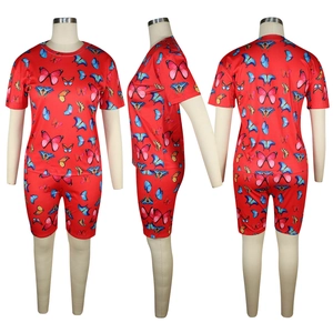 Detail view of red summer two-piece set featuring colorful butterfly print on slim fit fabric