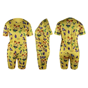 Three-view layout of yellow butterfly print set with crop top and cycling shorts