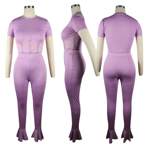 Three views of purple two-piece yoga set with mesh stitching and flared leggings