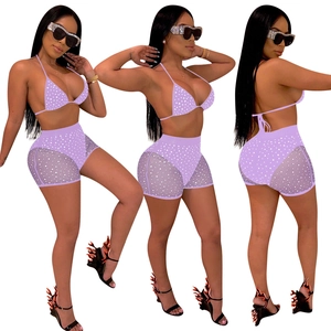 Women's purple polka dot bikini set with high-waisted mesh panel shorts