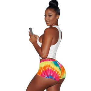Close-up of side view on white crop top and vibrant tie-dye athletic shorts set