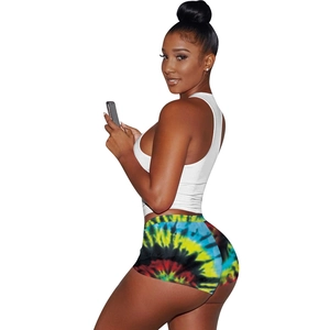 Women's summer two-piece athletic set with white tank top and colorful tie-dye shorts