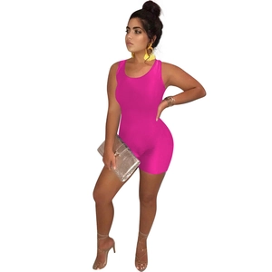 Detail of hot pink sleeveless bodycon romper with scoop neck and elastic slim fit fabric