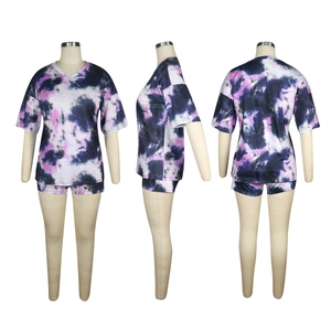 Detail view of tie-dye loungewear set featuring V-neck top and shorts in purple and blue
